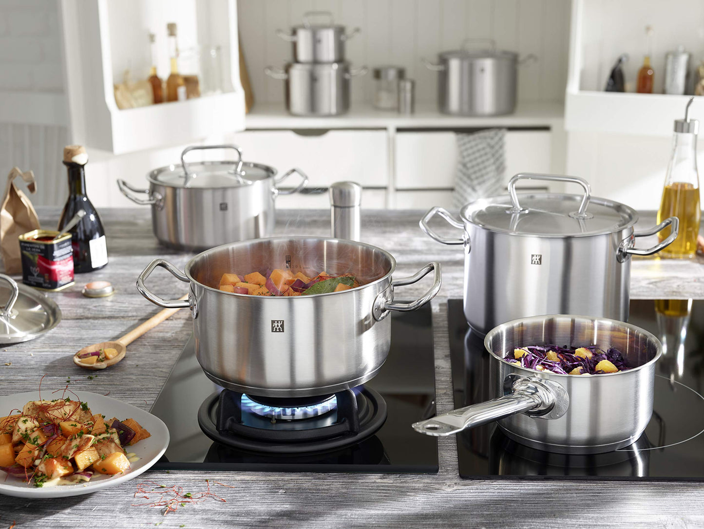 ZWILLING Twin Classic 12-Piece Stainless Steel Cookware Set – All Cooktops – Dripless Rims + Integrated Measuring Scale being used on a stove