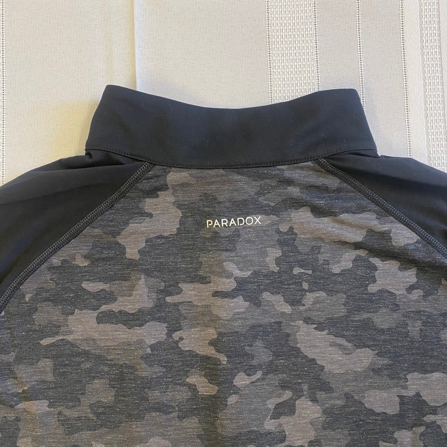 Paradox Women's Black Camouflage Quarter-Zip Pullover – Long Sleeve Activewear, Size Medium showing back view of brand emblem