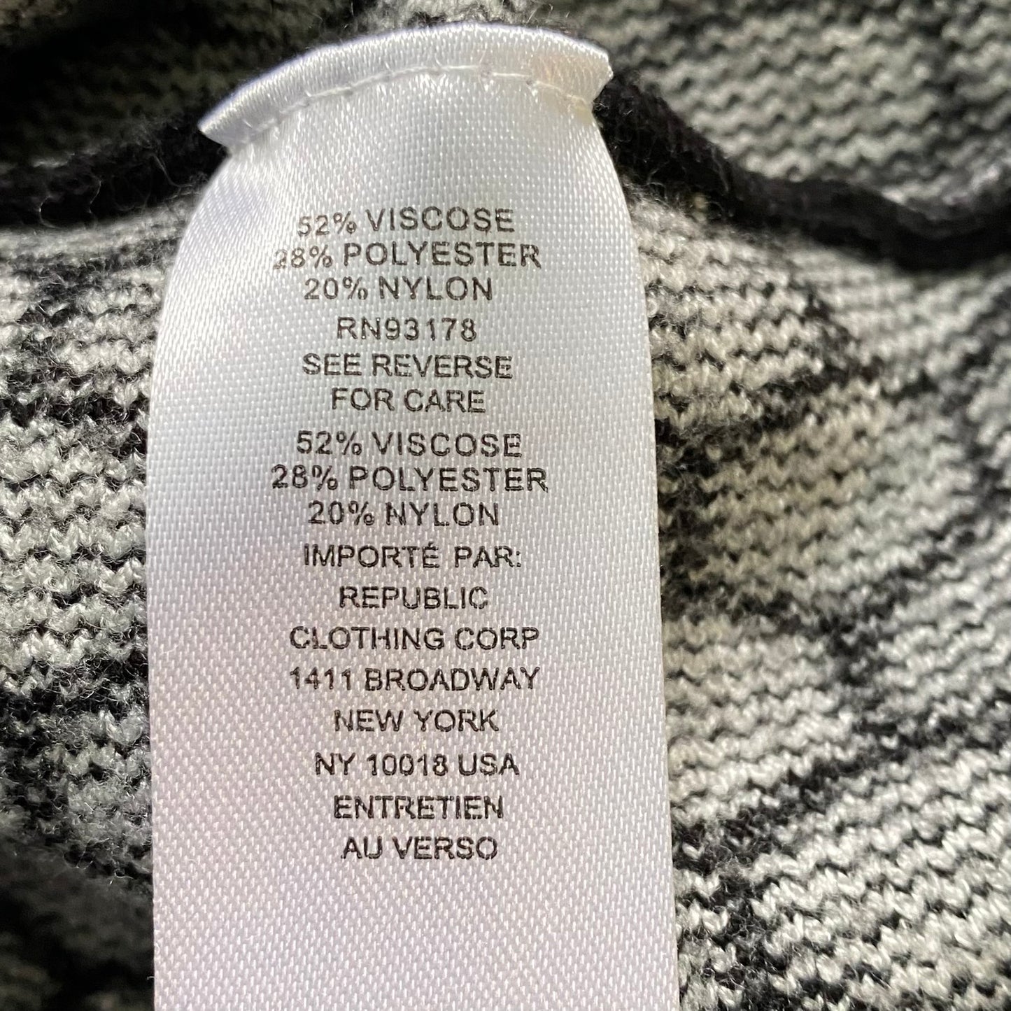 Women's Geometric Knit Sweater – Chic & Cozy – Size Medium (Industry) showing fabric tag