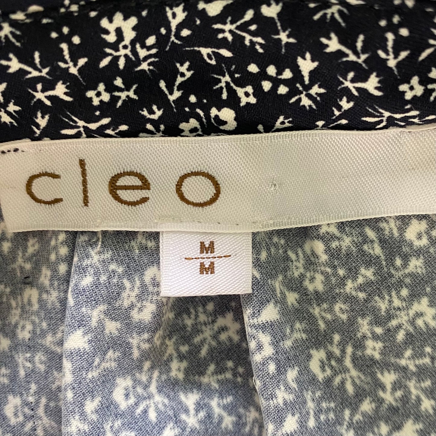 Navy Sleeveless Blouse – Micro Floral Print – Lightweight & Sustainable – Size M (Cleo) garment tag