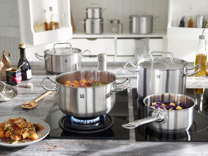 ZWILLING Twin Classic 12-Piece Stainless Steel Cookware Set – All Cooktops – Dripless Rims + Integrated Measuring Scale being used on a stove