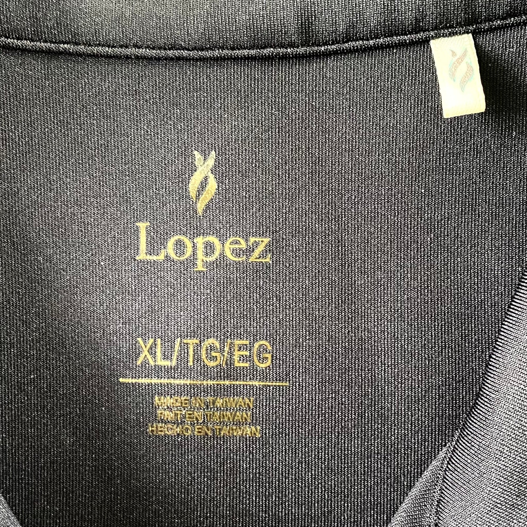 Women's Full-Zip Golf Jacket – Stretchy & Lightweight – Size XL (Nancy Lopez Golf) close up view of garment tag