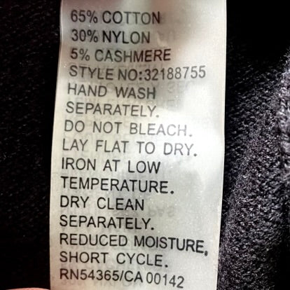 Women’s Black Button-Up Cardigan Sweater – Size Medium [Peter Nygård] garment tag with fabric and care