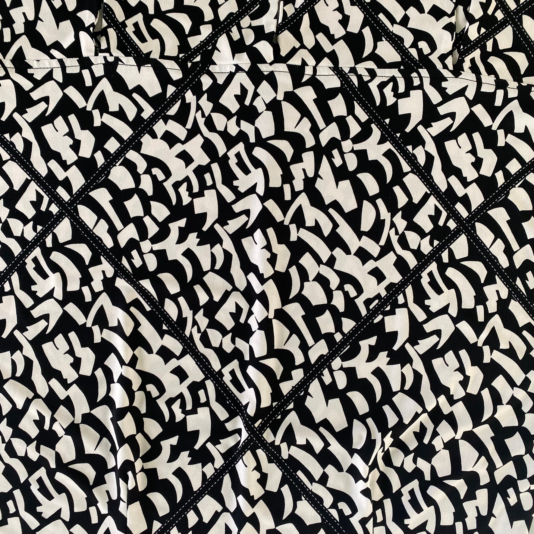 Geometric Print Sleeveless Dress – Knee-Length – Made in Canada – Size 12 (Joseph Ribkoff) close up of pattern