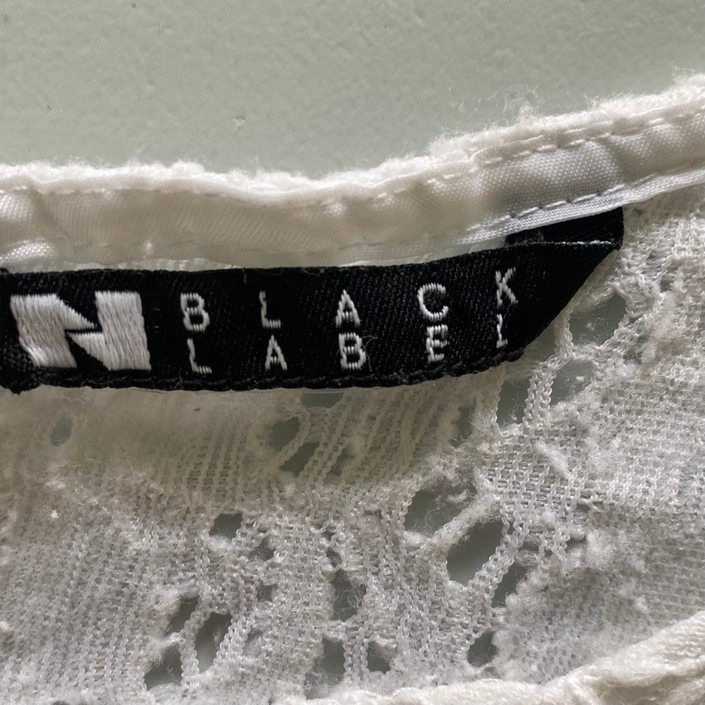 White Lace Short Sleeve Blouse – Stretch Nylon Blend – Size L (Black Label) garment tags